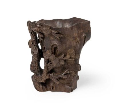 CARVED AGARWOOD LIBATION CUP QING DYNASTY, 18TH-19TH CENTURY  清 沉香木雕松木盃 naturalistically carved as a burled tree trunk envelo