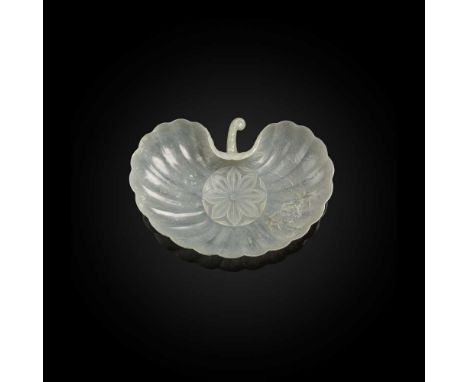 MUGHAL-STYLE PALE CELADON JADE SHELL-FORMED DISH QING DYNASTY, 18TH CENTURY  清 痕都斯坦青白玉雕蚌式盤 elegantly and thinly carved in the