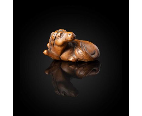 WOOD NETSUKE OF A HORSE BY YASUTADA EDO PERIOD, EARLY TO MID 19TH CENTURY  江戶 十九世紀 木彫根付 馬 銘「安忠」 the recumbent horse with its 