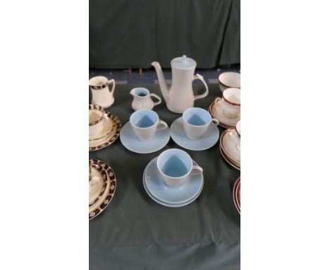 A Poole Part Coffee Set Comprising Coffee Pot, Cream Jug, Four Saucers and Three Coffee Cans 