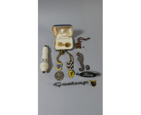A Box of Curios to Include Enamelled Goodwood Badges, Ford and Ferrari Badges, Cufflinks, Cortina Badge etc 