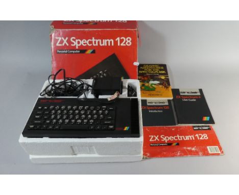 A Vintage ZX Spectrum 128 Personal Computer in Original Box with Unser Guide, Introduction and Graphic Adventures Book 