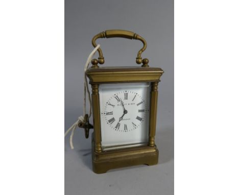 A Miniature Brass Cased Carriage Clock with White Enamelled Dial by Elliot & Son, London, 9cm High 