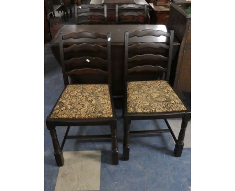 A Mid 20th Century Oak Drop Leaf Gate Legged Table and Two Ladder Back Chairs 