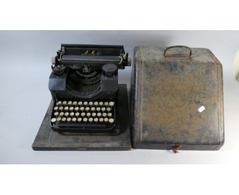 A Vintage AMC Typewriter in Metal Case 