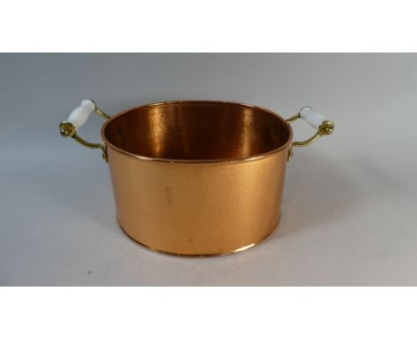 A Copper Oval Pan with Twin Ceramic Handles, 35cm Wide 