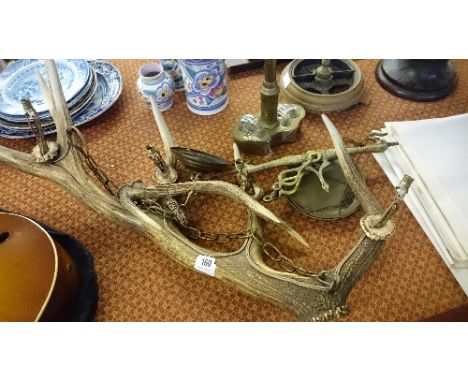 An antler ceiling light fitting.
