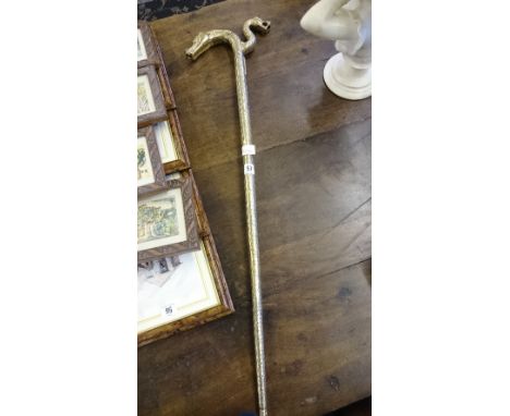 A Chinese style twin handled brass walking stick.