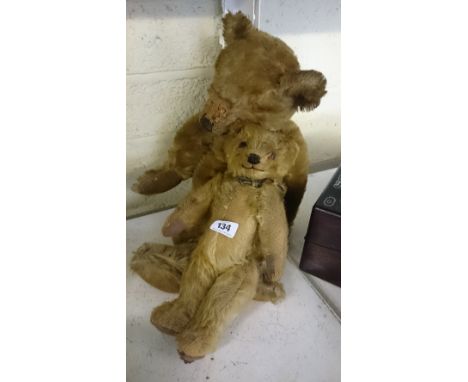 An early 20th Century Chiltern straw filled teddy bear together with a Chad Valley teddy bear.