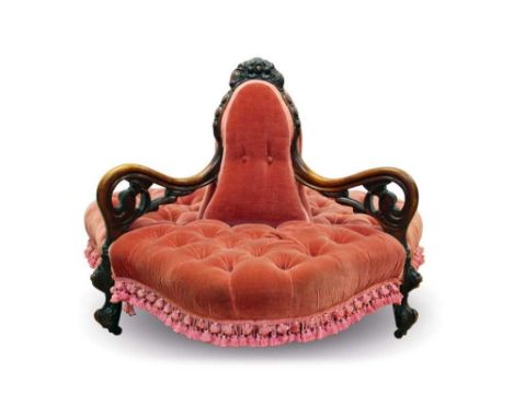 Victorian walnut conversation seat, triangular shaped form with three velvet button upholstered seats between carved scrollin