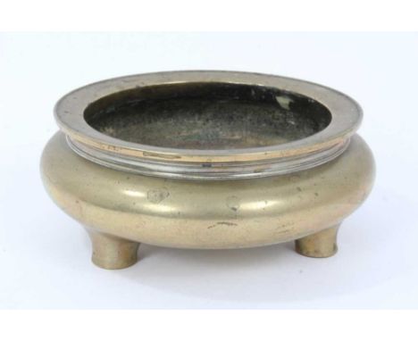 Old Chinese brass censor of squat form on three feet with seal mark to base. 15cm diameterCondition report: Good original con