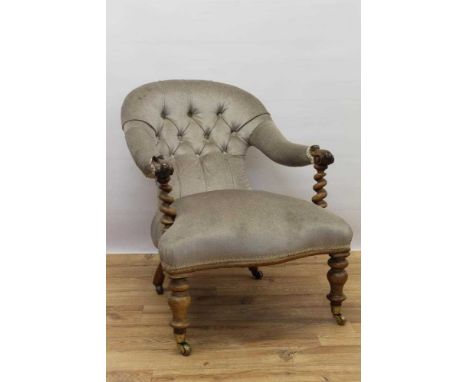 Victorian upholstered easy chair, with button upholstered spoon shaped back and spiral carved and knopped walnut supports and