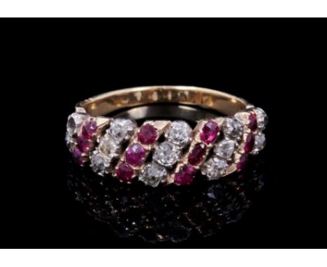 Regency diamond and ruby ring with alternating rows of old cut diamonds and mixed cut rubies in gold and silver closed back s