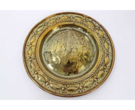 17th century German brass alms dish, with Adam and Eve embossed convex roundel and broad geometric border, 35cm diameterProve