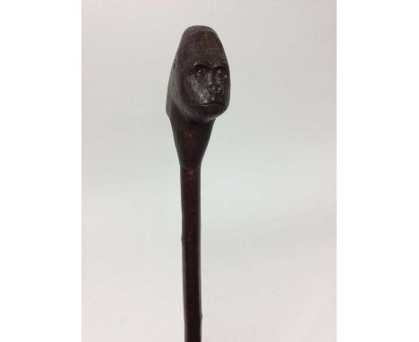 Antique walking stick with carved gorilla head handle and metal ferrule, 144cm longCondition report: Good original condition,