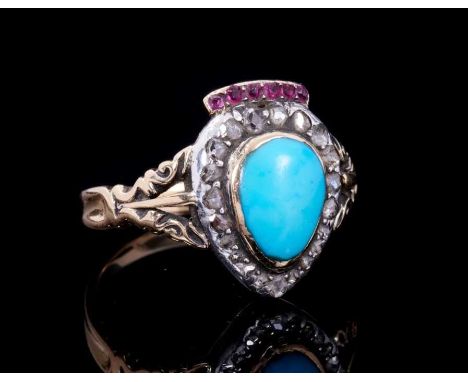 Antique turquoise, diamond and ruby heart shape cluster ring with a pear shape turquoise cabochon surrounded by a border of r