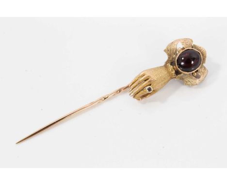 Regency/Early Victorian gold and garnet clasp in the form of a hand, converted to a stick pin, naturalistically modelled and 