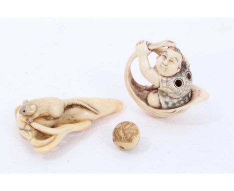 Late 19th / early 20th century carved ivory netsuke, carved as a rat on a fruit, 6cm long, together with another of a man in 