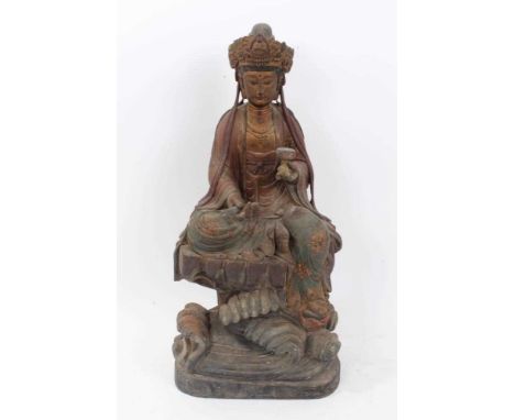 Antique Chinese carved wood figure of a seated Deity, in meditative pose how,ing scroll and lotus flower, with polychrome and