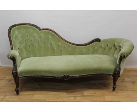 Victorian walnut framed chaise longue, with green button upholstery and carved showwood frame on cabriole legs and castorsCon