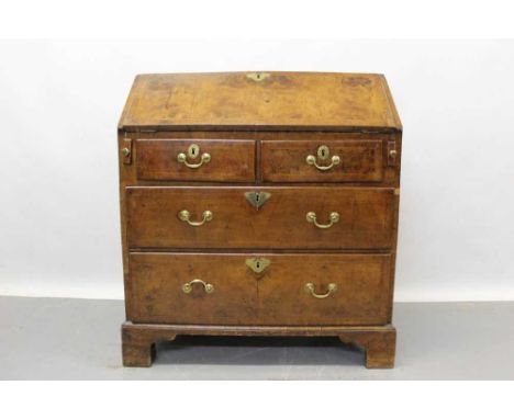 Early 18th century walnut feather banded bureau, with fitted interior of short drawers and pigeonholes over two short over tw