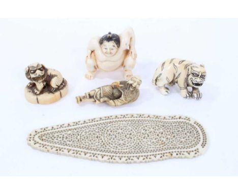 19th century pieced ivory plaque, passably a stay busk, 13cm long, and four Japanese carved ivory netsuke