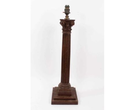 Early 20th century carved oak Corinthian column table lamp, on square stepped base, 59cm high