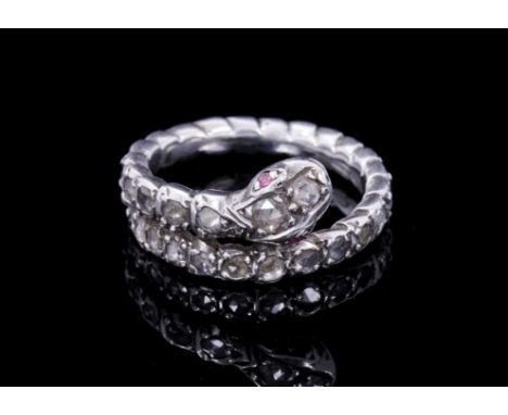 Antique diamond snake ring with two ruby eyes and a body of rose cut diamonds in silver collet setting, ring size approximate