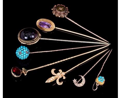 Group of eight antique gem-set stick pins to include 14k gold and seed pearl fleur de lys stick pinProvenance: Estate of the 