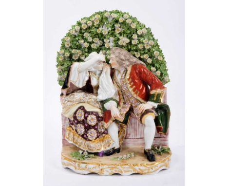 Large and impressive Continental Derby style porcelain group, showing a courting couple on a bench, gold anchor mark on the b