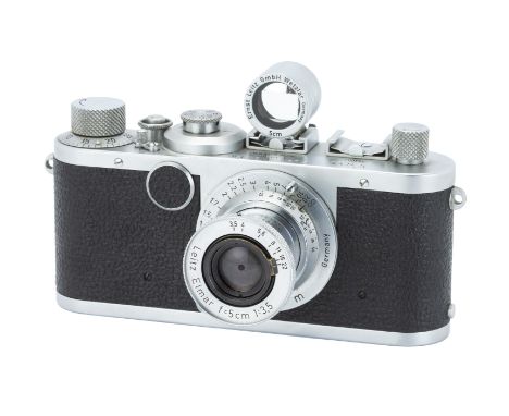 A Leica Ic Camera,1951, chrome, serial no. 560566, with Leitz Elmar f/3.5 50mm lens, 1950, chrome, serial no. 773389, body, V