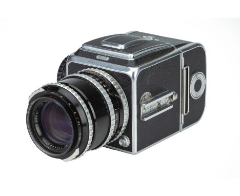 A Hasselblad 1000F Medium Format Camera,1954, chrome, serial no. CI14581, with Carl Zeiss Sonnar f/3.5 135mm lens, black, ser