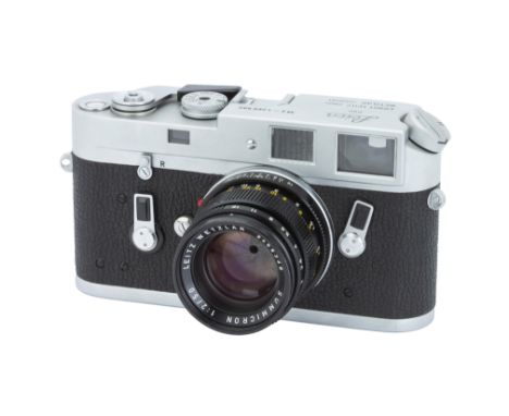 A Leica M4 Rangefinder Camera,1970, chrome, serial no. 1268992, with Leitz Summicron f/2 50mm lens, 1970, black, serial no. 2