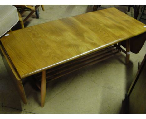 An Ercol light elm rectangular drop leaf coffee table, with spindle undertier