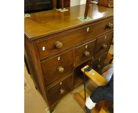 A 19th century mahogany chest, with 6 short and long drawer and recessed cupboard, bracket feet.