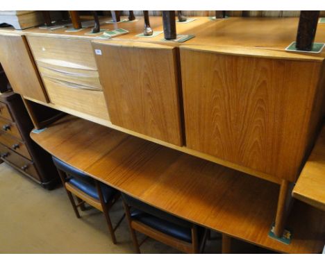 A Vintage Danish teak dining suite comprising oval extending dining table with pop-up leaf, a set of 4 matching low back dini