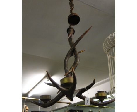 A 3 branch ceiling light fitting made from antlers