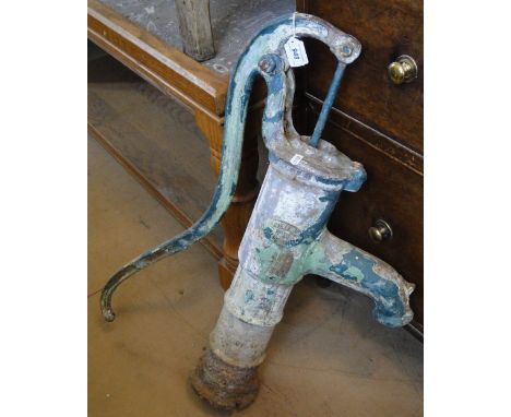 A Vintage cast-iron well pump, bearing plaque DeVille Ltd., No. 34.