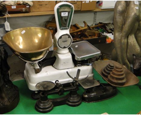An Avery balance scale and 2 other sets of scales and weights.