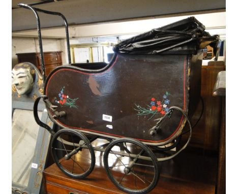 A Vintage painted dolls pram.