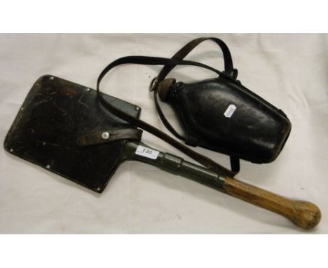 A First World War trench spade and a leather covered flask.