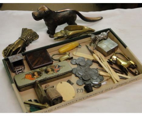 A cast-iron dog nutcracker, a hand design paperclip, a bird nutcracker, 1935 Silver Jubilee medallions in tin, etc.