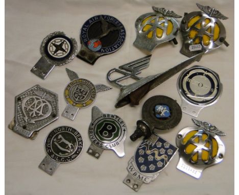 Various Vintage enamelled and other car badges and a car mascot.