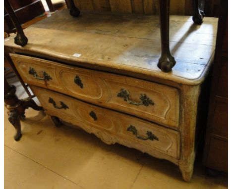 An Antique continental oak 2-drawer commode, with carved apron and cabriole legs.