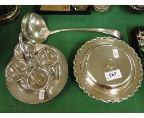 A silver plated muffin dish, 4-piece egg cup set and a plated ladle.