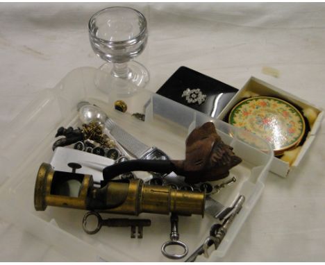 A pipe, a microscope, compacts etc