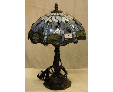 A Tiffany style table lamp with leadlight dragonfly design shade