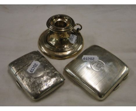 2 engraved silver cigarette cases, and a small silver chamber stick, 6 oz.