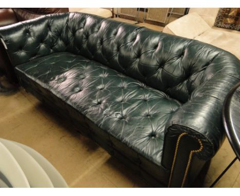 A Green button back leather Chesterfield sofa, length 6' 8"