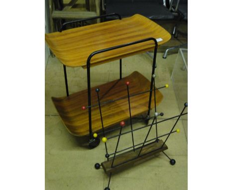A 1950s bent plywood and steel trolley, marked Glydette, makers label to underside, and a 1950s stick and ball magazine rack